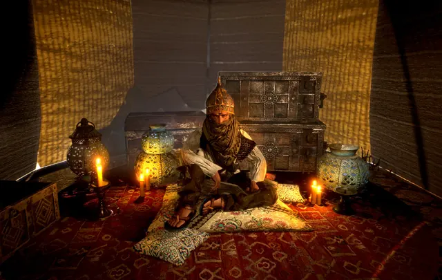 A mysterious inhabitant seated beside candles and relics